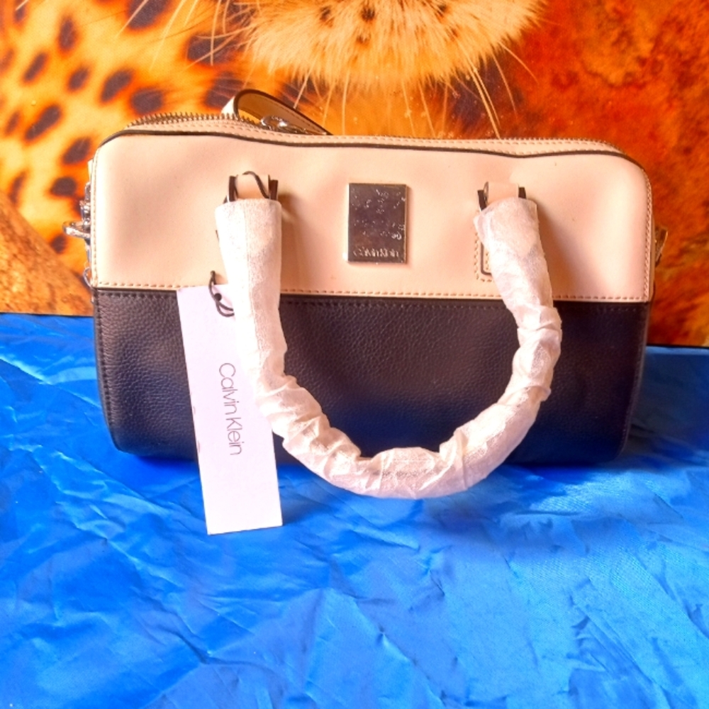Black and tan Calvin Klein hand bag.